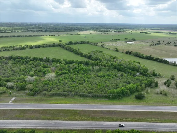 a view of a yard with a car parked