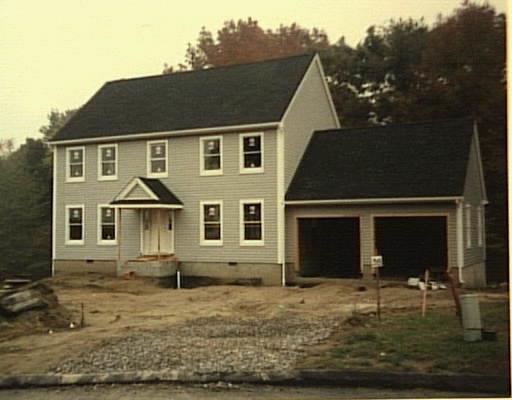 38 Lynn Place Ridgefield, CT 06877 - Photo 1 of 1 a front view of a house with garden