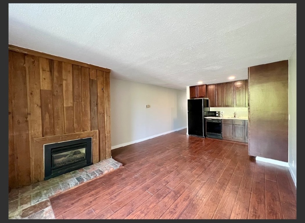760 Copper Road, Unit E111 Copper Mountain, CO 80443 - Photo 4 of 14 a view of kitchen with wooden floor electronic appliances and cabinets