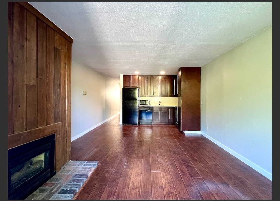 760 Copper Road, Unit E111 Copper Mountain, CO 80443 - Photo 5 of 14 a view of kitchen with livingroom and wooden floor