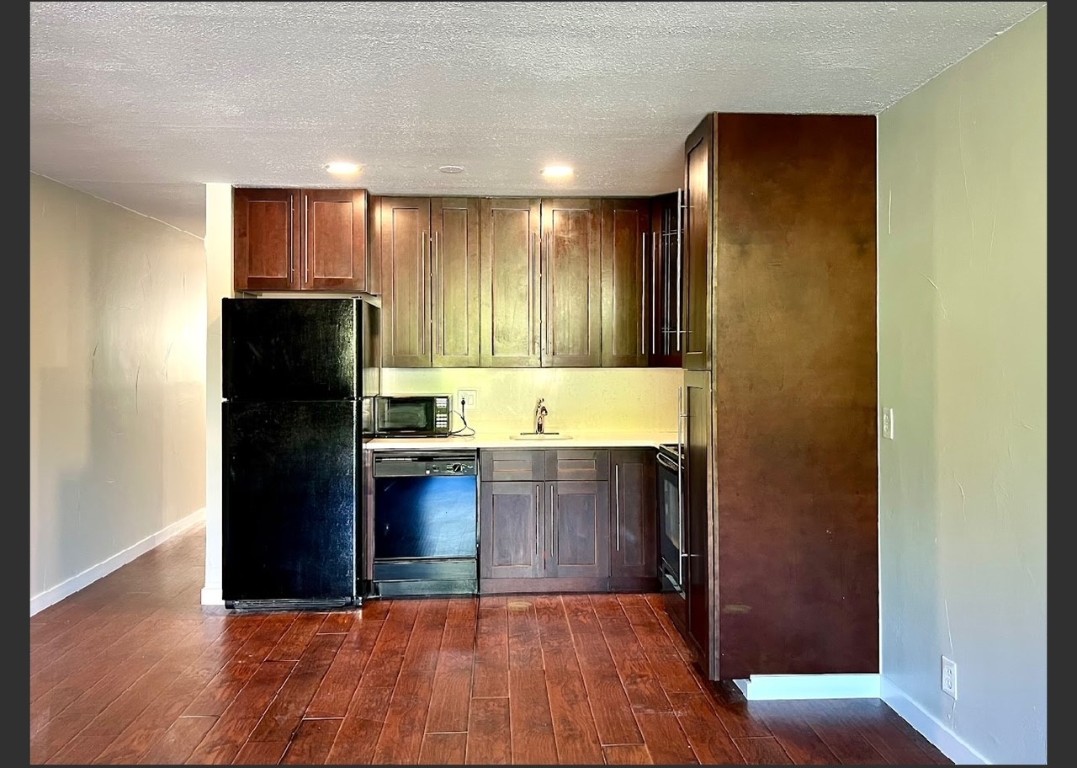 760 Copper Road, Unit E111 Copper Mountain, CO 80443 - Photo 6 of 14 a kitchen with granite countertop stainless steel appliances and refrigerator
