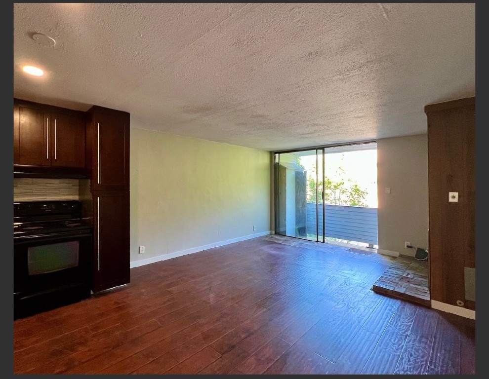 760 Copper Road, Unit E111 Copper Mountain, CO 80443 - Photo 7 of 14 a view of an empty room with wooden floor and a window