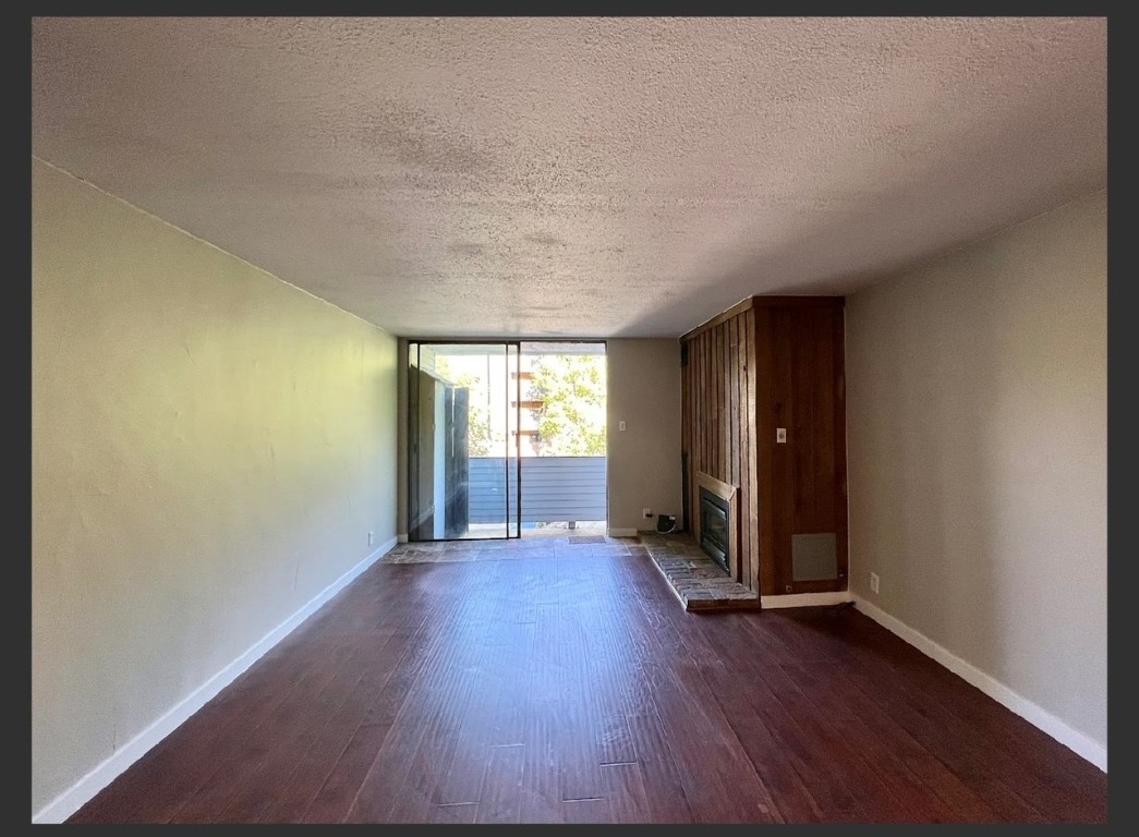 760 Copper Road, Unit E111 Copper Mountain, CO 80443 - Photo 8 of 14 an empty room with wooden floor and windows