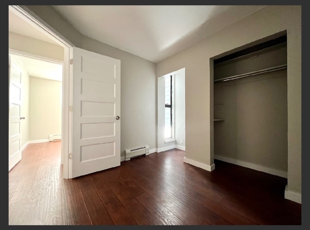 760 Copper Road, Unit E111 Copper Mountain, CO 80443 - Photo 9 of 14 an empty room with wooden floor & closet area