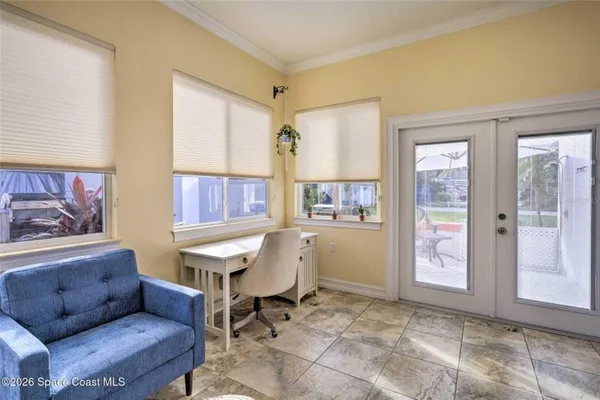 a living room with furniture and a window