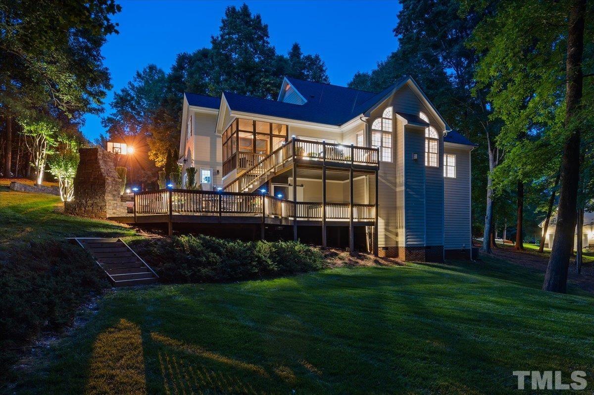 5017 Perception Lane Raleigh, NC 27613 - Photo 13 of 47 a view of a house with a big yard potted plants and large tree