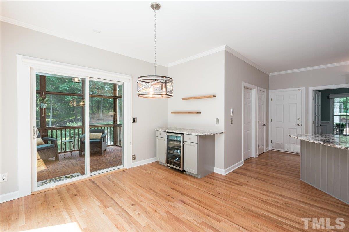 5017 Perception Lane Raleigh, NC 27613 - Photo 24 of 47 a open kitchen with stainless steel appliances granite countertop a refrigerator a stove and a wooden floors