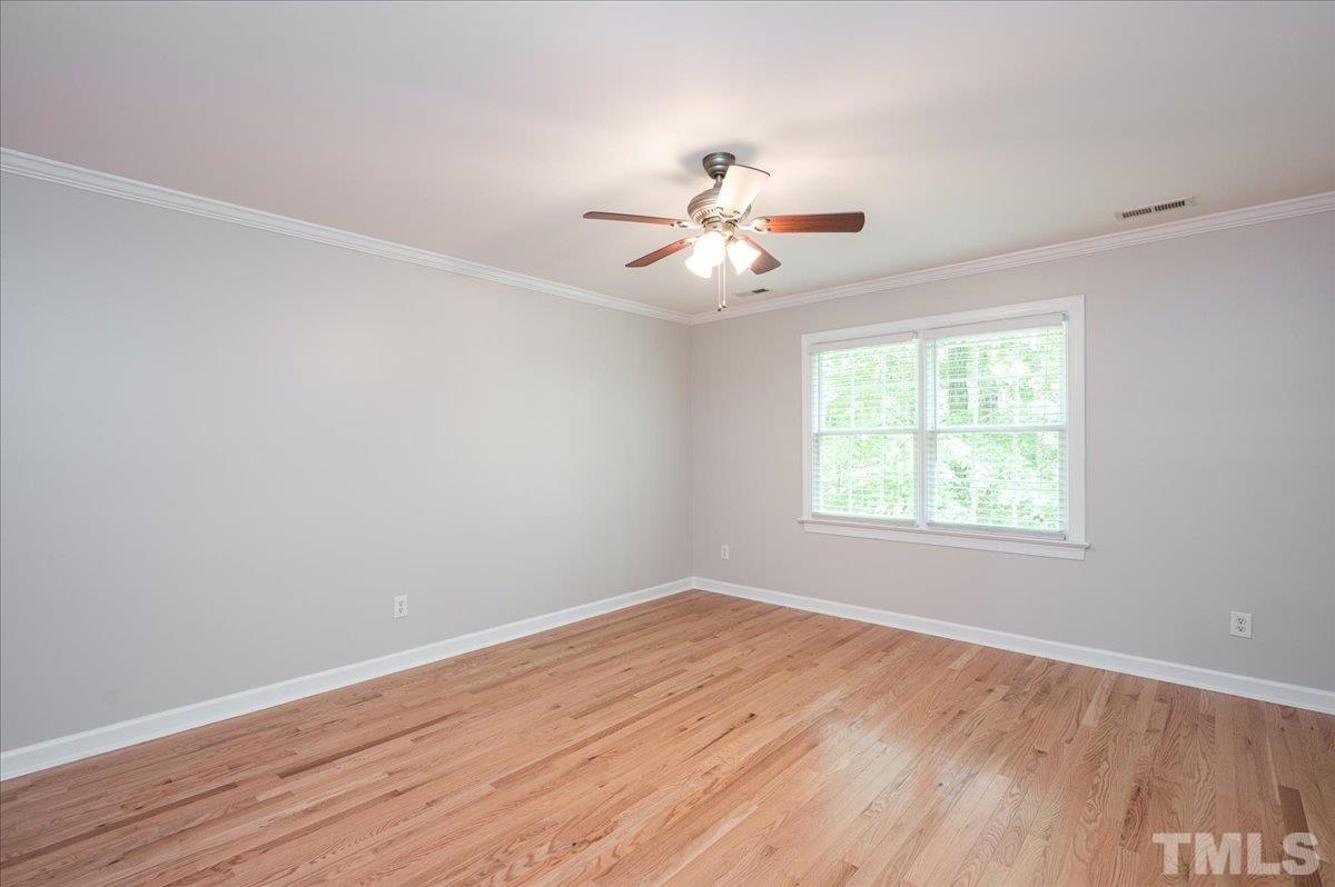 5017 Perception Lane Raleigh, NC 27613 - Photo 34 of 47 an empty room with wooden floor and window