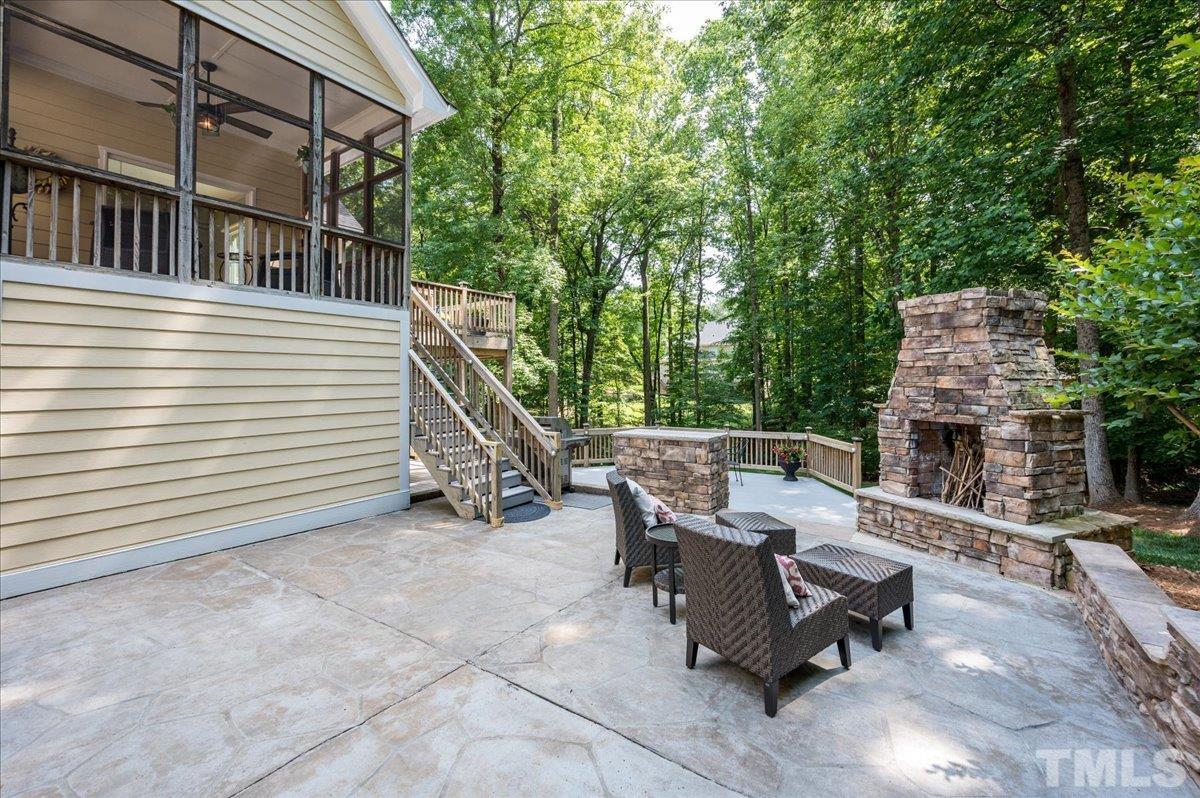 5017 Perception Lane Raleigh, NC 27613 - Photo 6 of 47 a view of a patio with table and chairs with wooden floor and fence