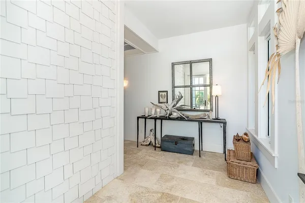 a view of a patio with couches table and chairs and potted plants
