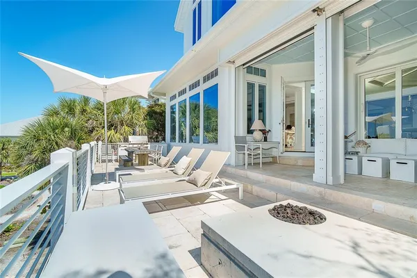 a bedroom with a bed a couch and dresser