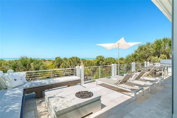 a view of a balcony with ocean view