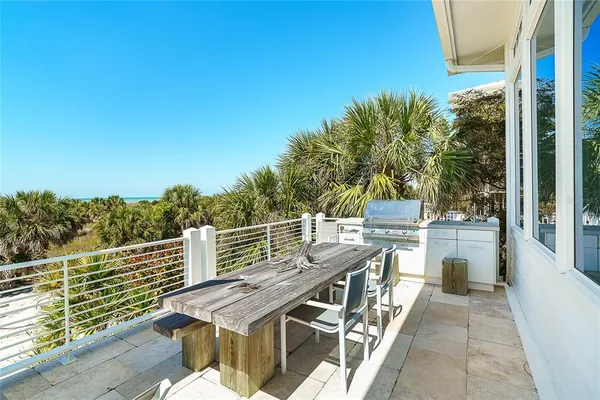 a spacious bathroom with a granite countertop sink a toilet and a mirror