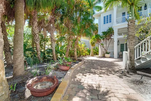 a view of a large building with a palm tree