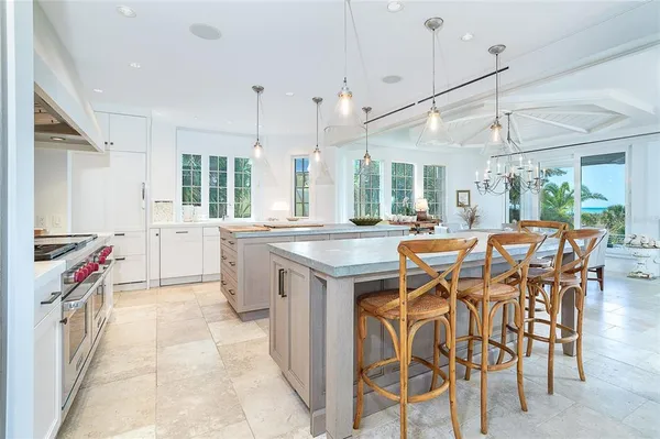 a bedroom with two beds and a desk