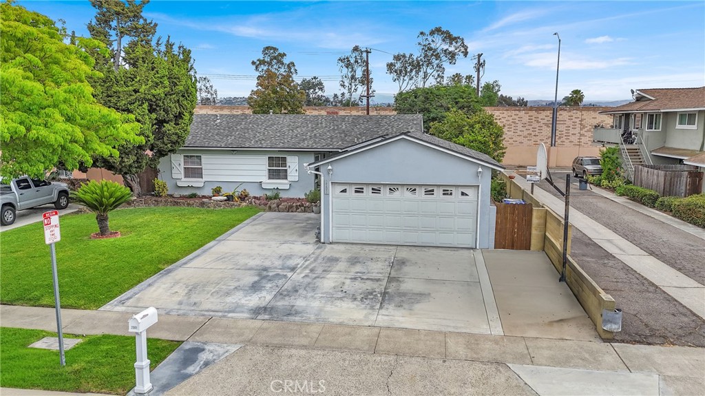 2501 Deodar Street Santa Ana, CA 92705 - Photo 1 of 43 a view of a house with a yard plants and large tree