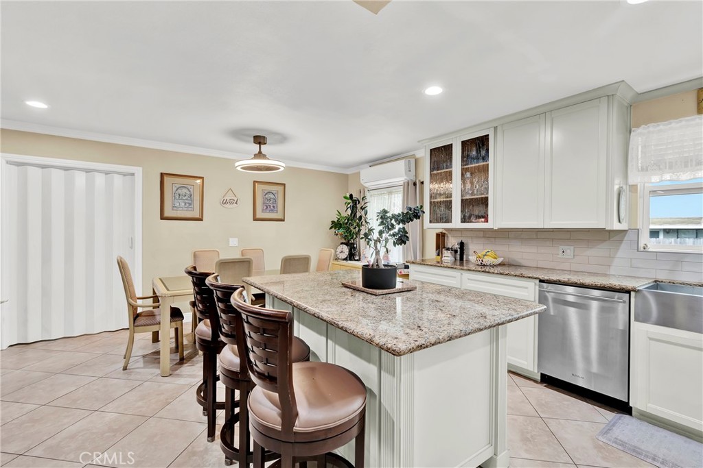 2501 Deodar Street Santa Ana, CA 92705 - Photo 14 of 43 a kitchen with a table chairs sink and cabinets