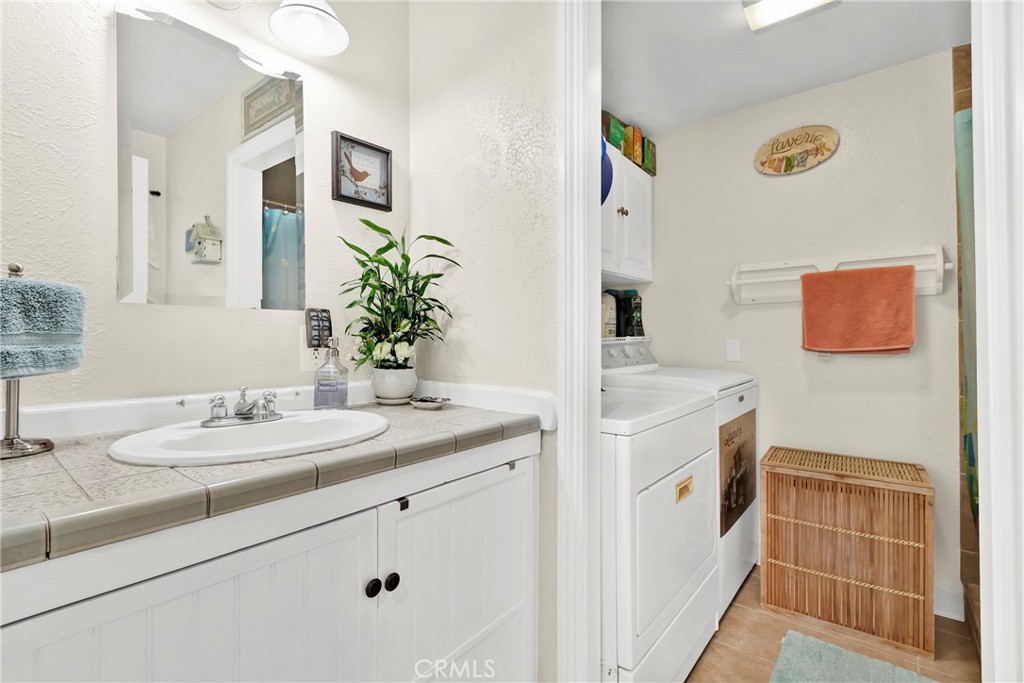2501 Deodar Street Santa Ana, CA 92705 - Photo 16 of 43 a bathroom with a sink and a mirror