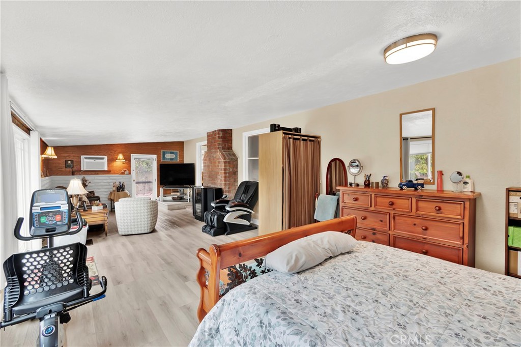 2501 Deodar Street Santa Ana, CA 92705 - Photo 19 of 43 a bedroom with furniture and a flat screen tv
