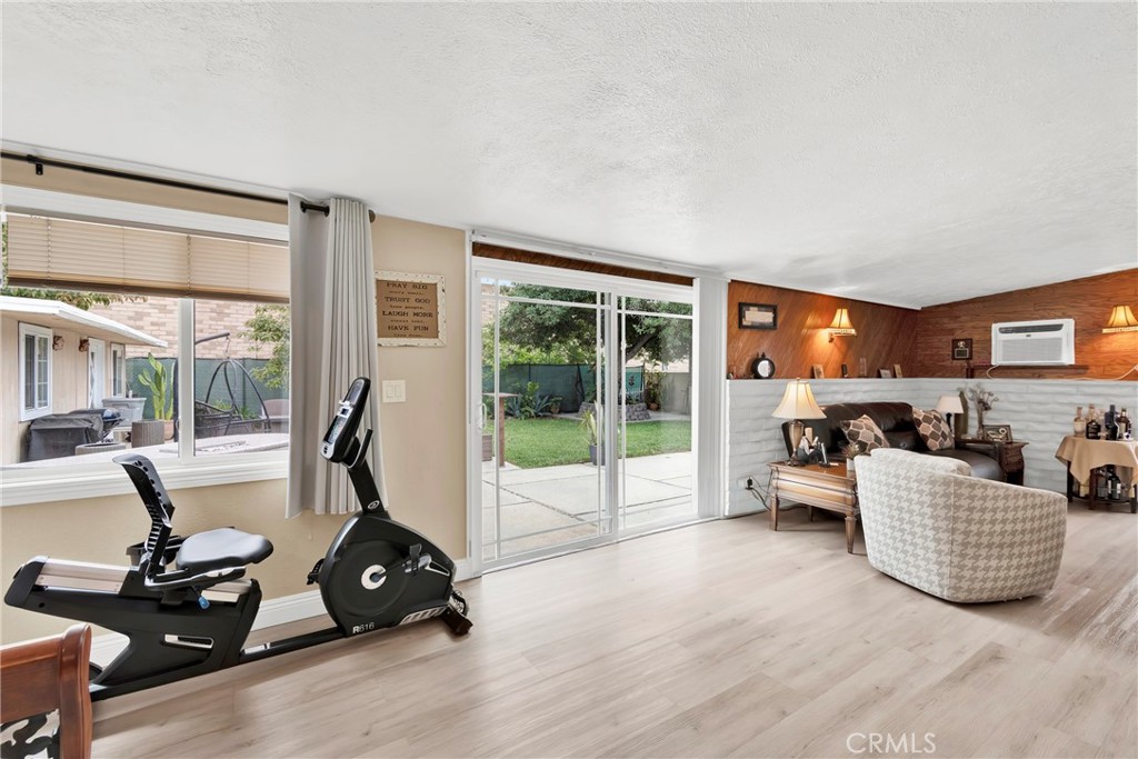 2501 Deodar Street Santa Ana, CA 92705 - Photo 20 of 43 a living room with furniture large windows and a flat screen tv
