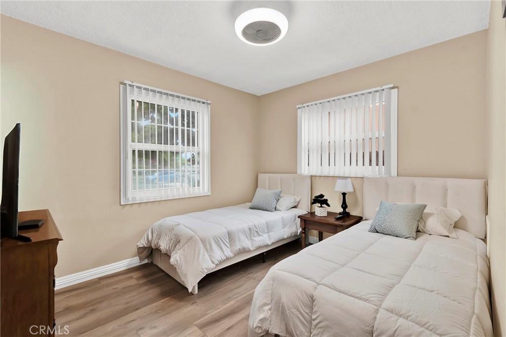 2501 Deodar Street Santa Ana, CA 92705 - Photo 23 of 43 a bedroom with two beds and a flat screen tv