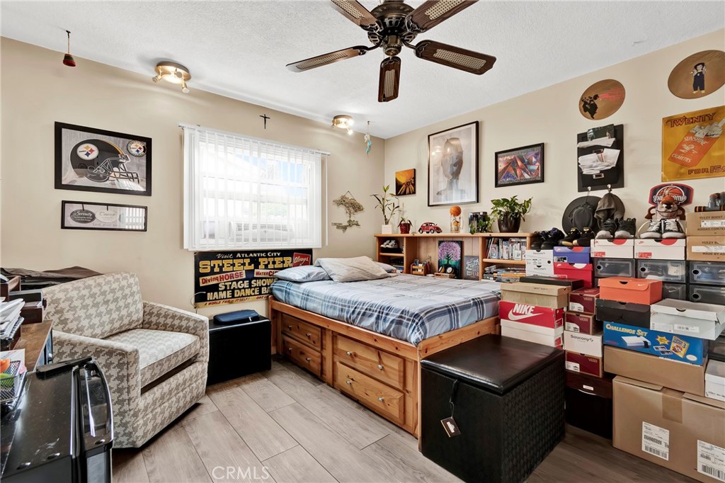 2501 Deodar Street Santa Ana, CA 92705 - Photo 26 of 43 a bedroom with a bed and wooden floor
