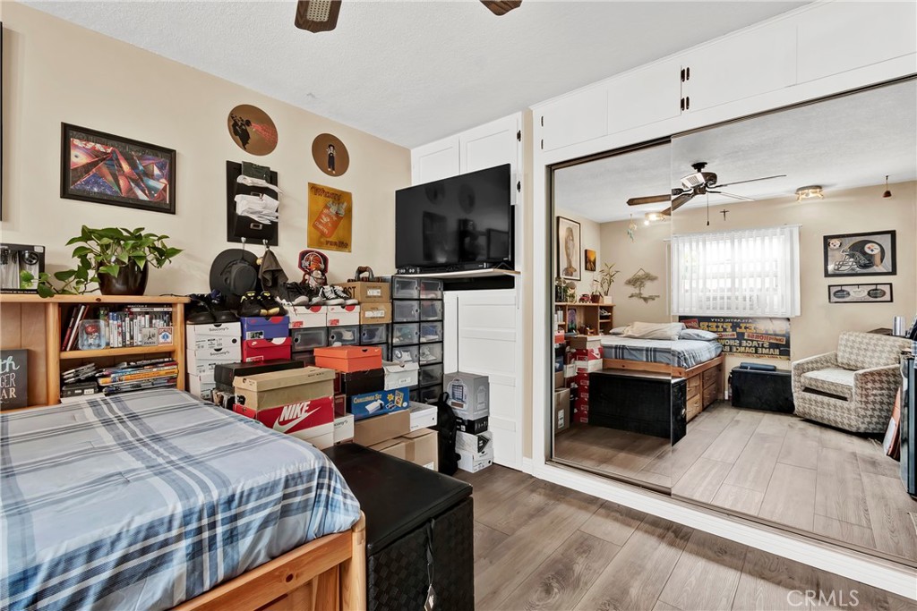 2501 Deodar Street Santa Ana, CA 92705 - Photo 27 of 43 a bedroom with furniture and a flat screen tv