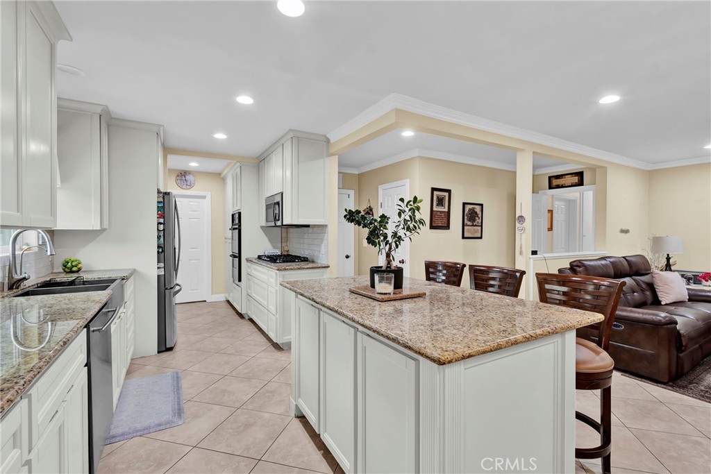 2501 Deodar Street Santa Ana, CA 92705 - Photo 10 of 43 a kitchen with granite countertop a sink and cabinets