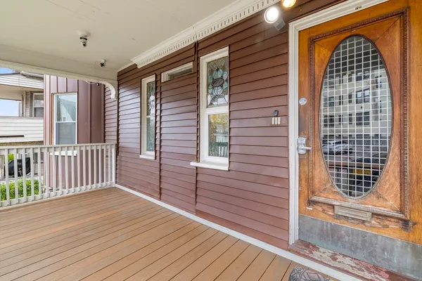 a view of balcony with wooden floor