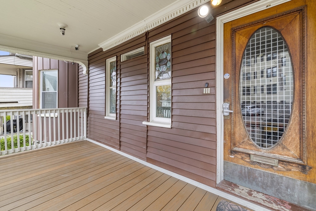 a view of balcony with wooden floor