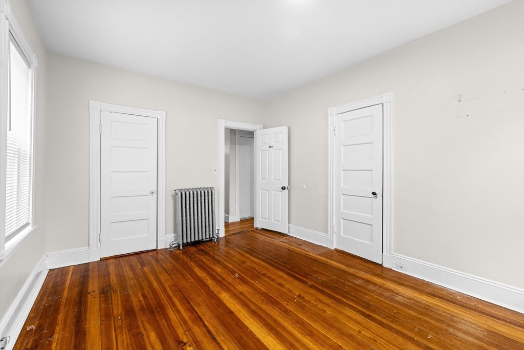 27 Brinsley Street, Unit 1 Boston, MA 02121 - Photo 14 of 16 a view of a livingroom with wooden floor and closet