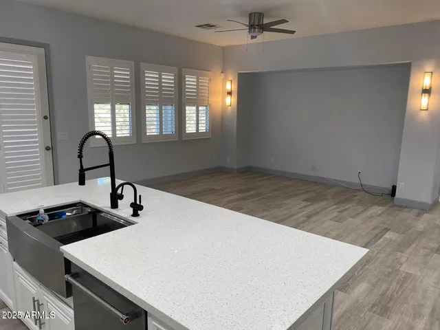 a bathroom with double sink and a mirror