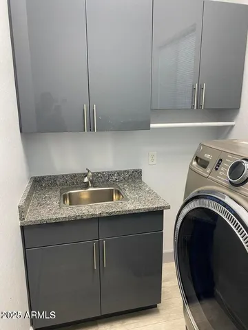 a bathroom with a shower and a sink