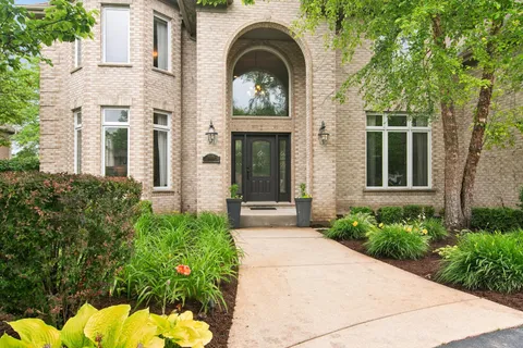 front view of a house with a garden