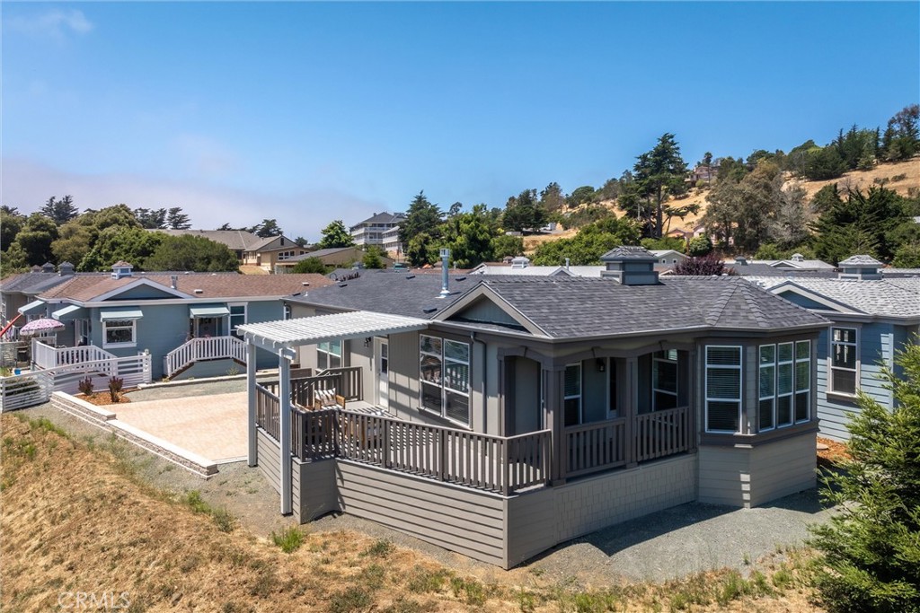 1460 Main Street, Unit 114 Cambria, CA 93428 - Photo 1 of 1 a view of a house with a yard