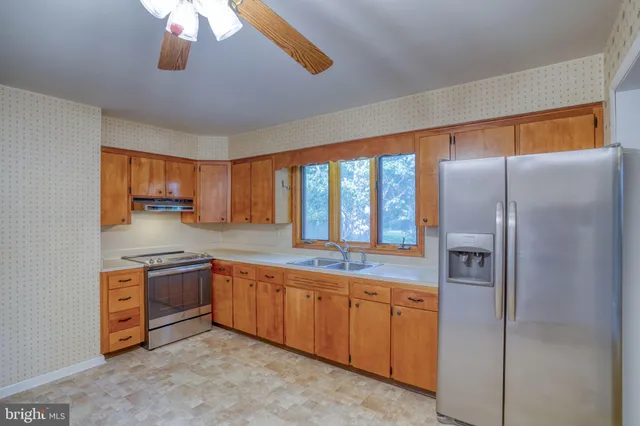 a view of a kitchen with electric appliances