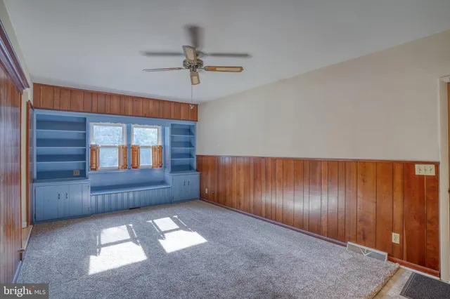 a view of empty room with a fireplace