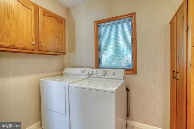 a view of bathroom with a sink toilet and a mirror