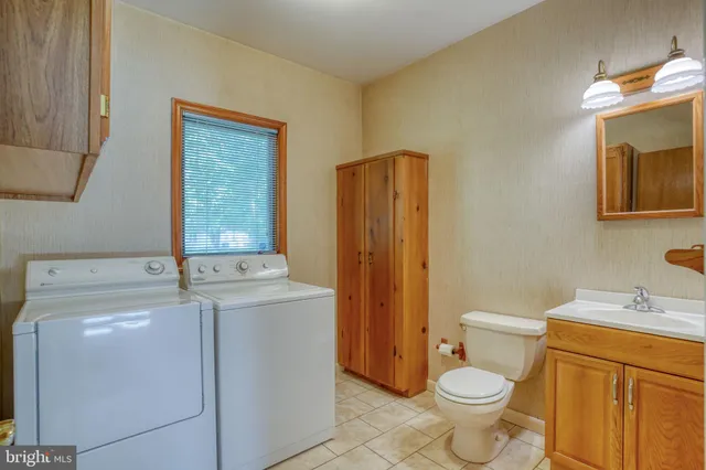 a bedroom with a bed and a dresser in it