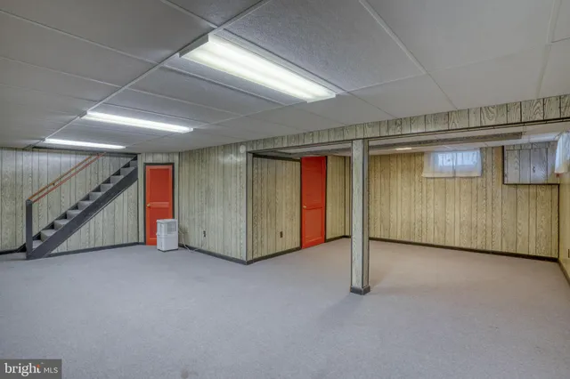 a view of an empty room with a fireplace