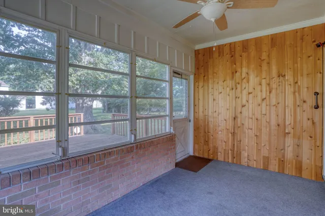 a view of deck with wooden floor and fence
