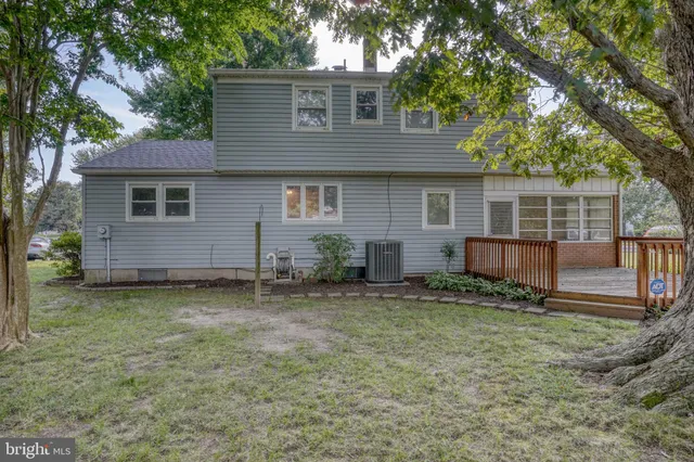 a view of a tree in front of a house
