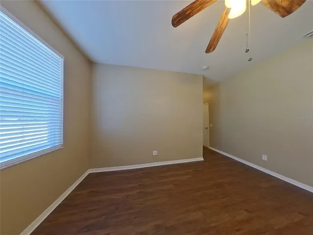 an empty room with a empty space and a window