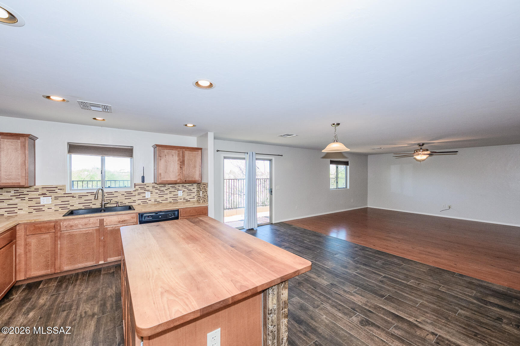 728 South Porter Routh Place Vail, AZ 85641 - Photo 12 of 36 an empty room with wooden floor and windows