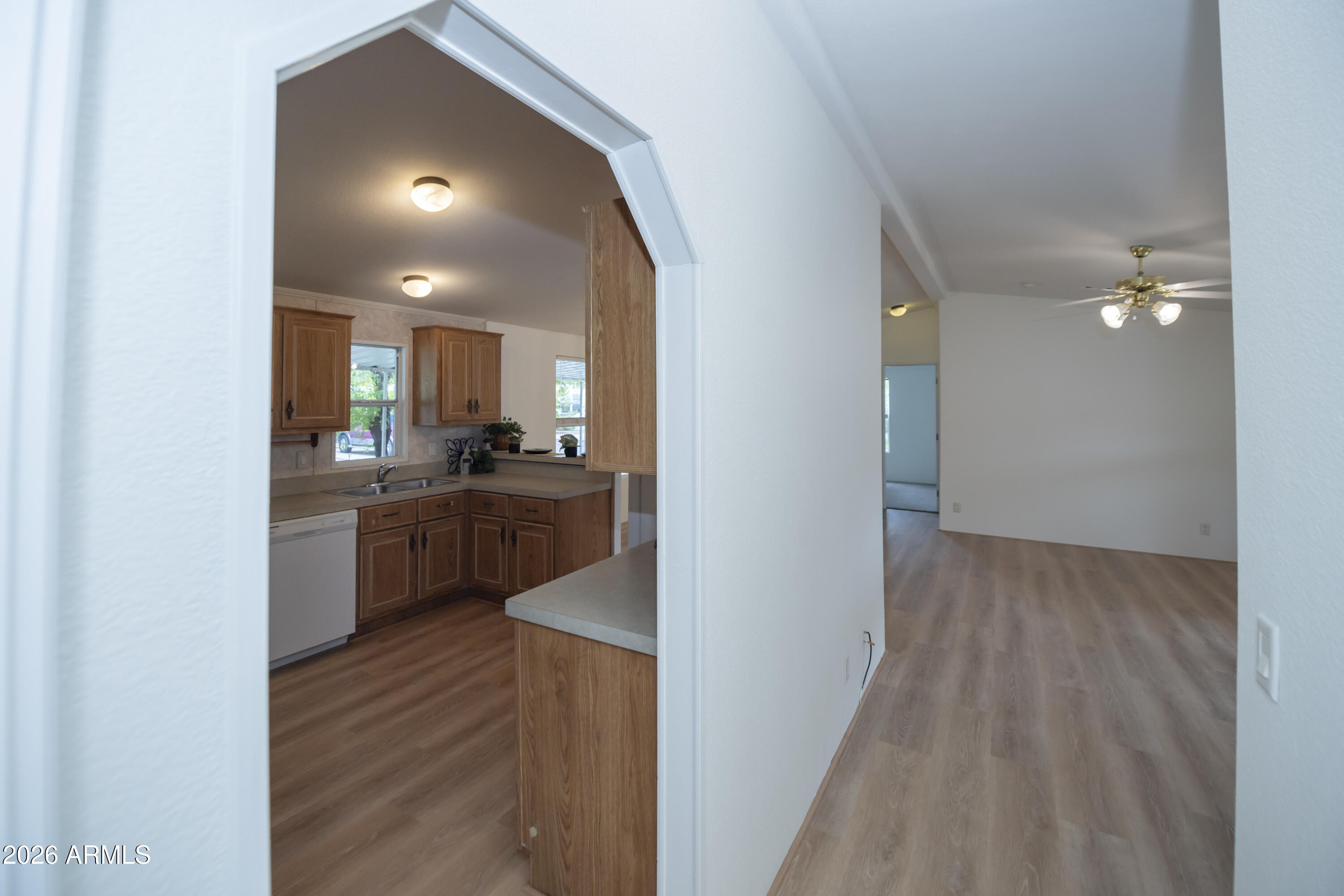 11250 East State Rte 69, Unit 1125 Dewey, AZ 86327 - Photo 24 of 45 a kitchen with a refrigerator and a sink