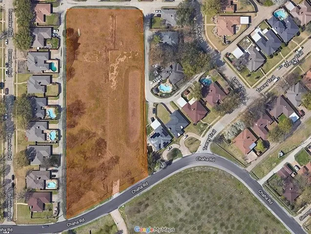 an aerial view of a residential apartment building with a outdoor space