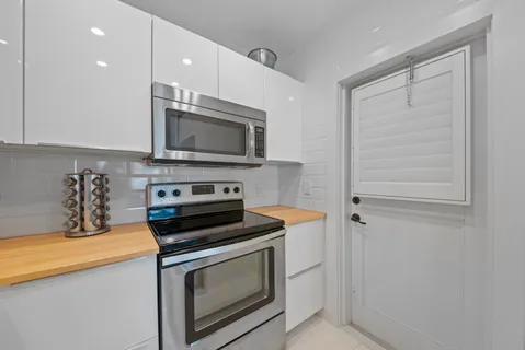a kitchen with a stove and a microwave