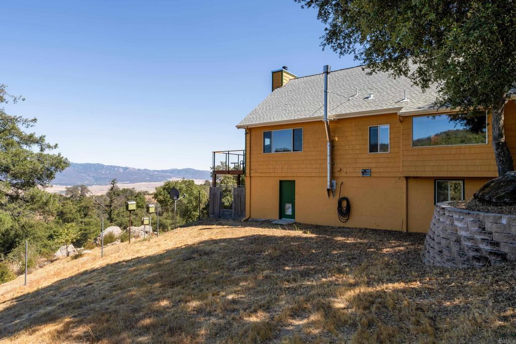 25770 East Grade Road Santa Ysabel, CA 92070 - Photo 41 of 75 a front view of a house with a yard