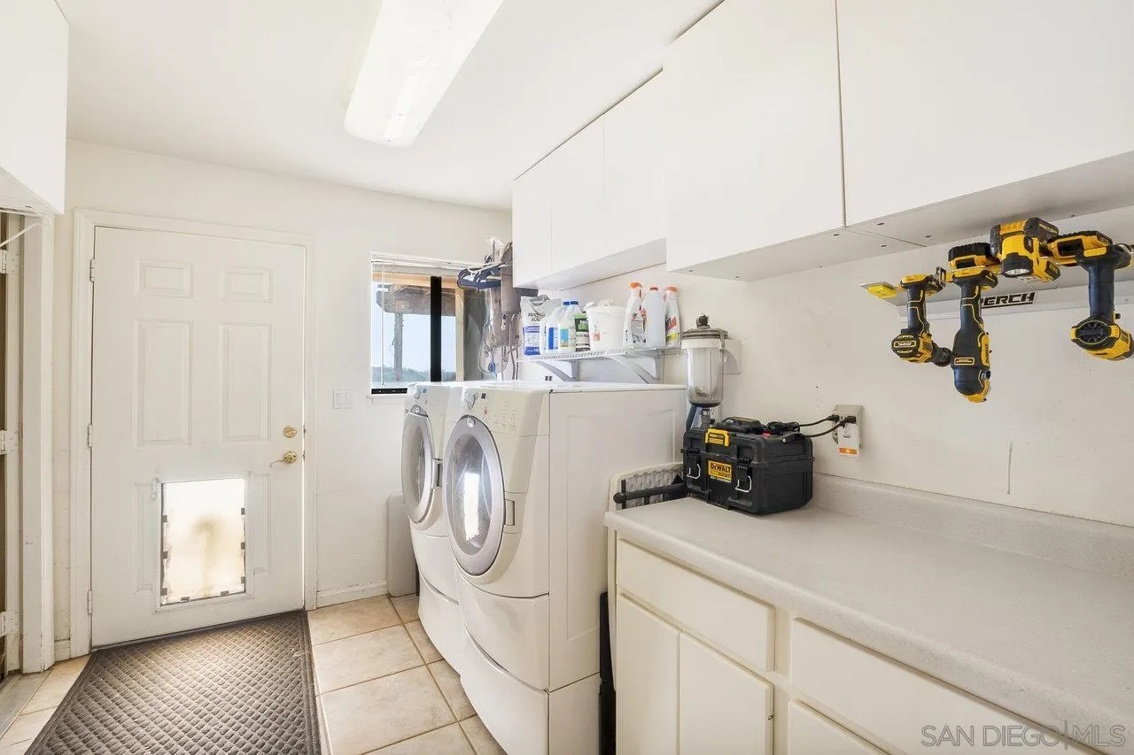 18995 Highway 94 Dulzura, CA 91917 - Photo 22 of 55 a view of a storage and utility room with washer and dryer