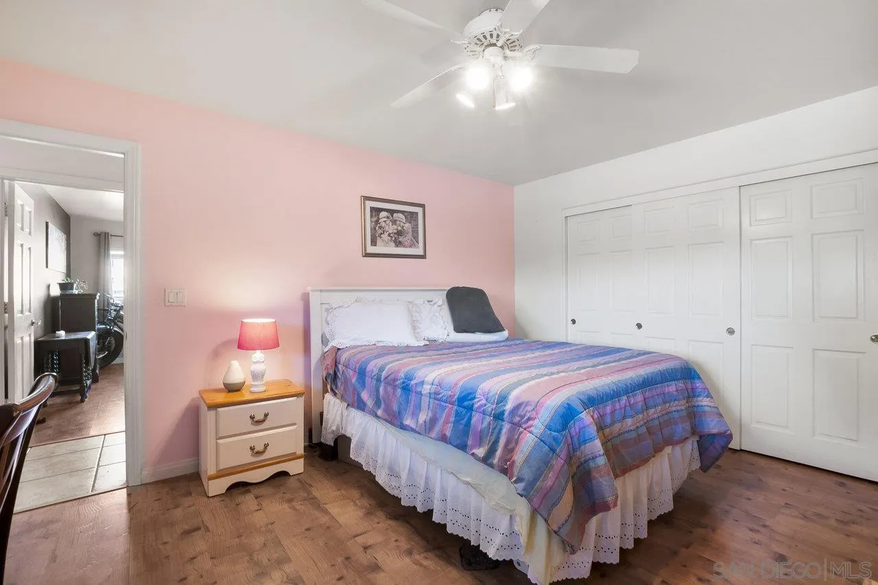 18995 Highway 94 Dulzura, CA 91917 - Photo 26 of 55 a bedroom with a bed and a chandelier